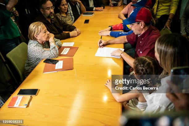 Opposition leader Henrique Capriles signs his presidential candidacy application at the national primary commission on June 24, 2023 in Caracas,...