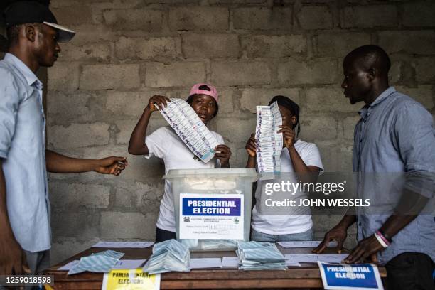 Election officials start counting votes at a voting station in Freetown on June 24, 2023 during the presidential vote. Sierra Leoneans began voting...