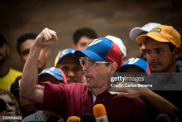 Opposition leader Henrique Capriles addresses the media after signing his presidential candidacy application at the national primary commission on...