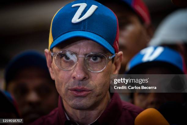 Opposition leader Henrique Capriles addresses the media after signing his presidential candidacy application at the national primary commission on...