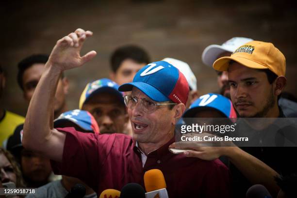 Opposition leader Henrique Capriles addresses the media after signing his presidential candidacy application at the national primary commission on...