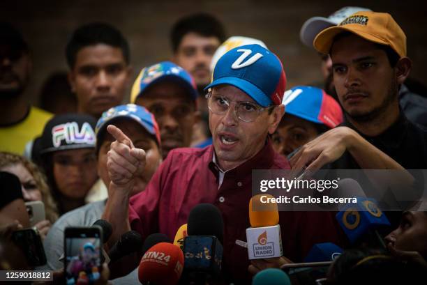 Opposition leader Henrique Capriles addresses the media after signing his presidential candidacy application at the national primary commission on...