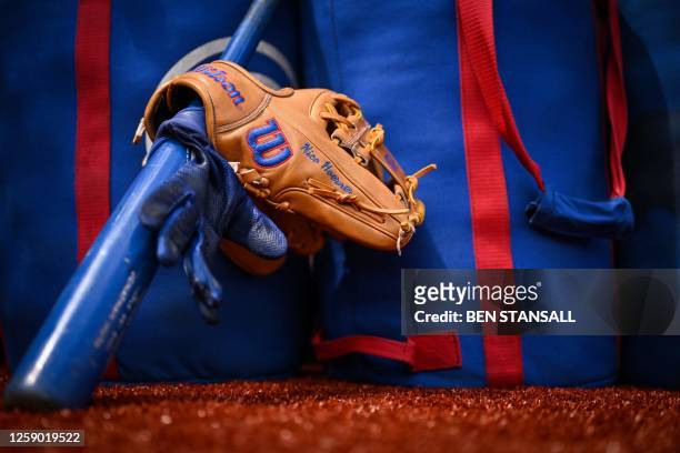The glove and bat of Chicago Cubs' Nico Hoerner are pictured prior to the first of the two-game, 2023 major league baseball London Series between the...