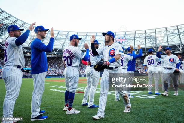 Chicago Cubs players celebrate victory over the St. Louis Cardinals during the 2023 London Series game between the Chicago Cubs and the St. Louis...