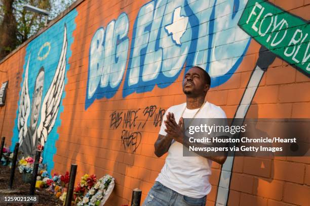 Rap artist Cal Wayne poses for a portrait at the George Floyd memorial mural in 3rd Ward Friday, March 26, 2021 in Houston. Wayne said he expects to...