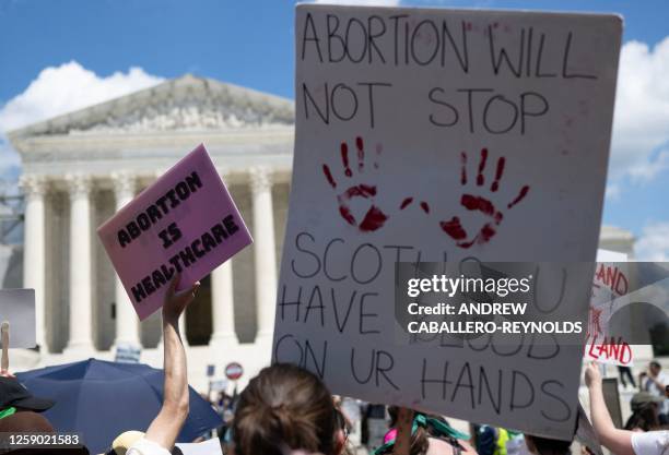 Abortion rights demonstrators rally to mark the first anniversary of the US Supreme Court ruling in the Dobbs v Women's Health Organization case in...