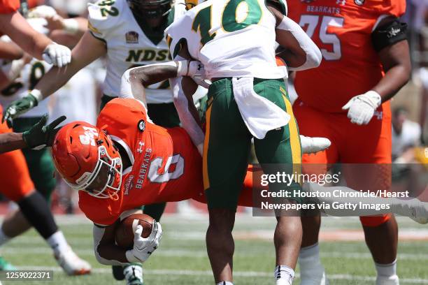 Sam Houston State running back Noah Smith is stopped just short of the goal line by North Dakota State safety Dom Jones during the first quarter of a...