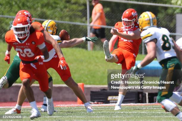 Sam Houston State punter Matt McRobert has his punt blocked by North Dakota State, that rolled out of the back of the end zone for a safety during...