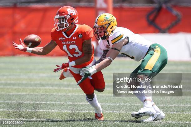 Sam Houston State defensive back Isaiah Downes intercepts a pass intended for North Dakota State wide receiver Christian Watson during the first...