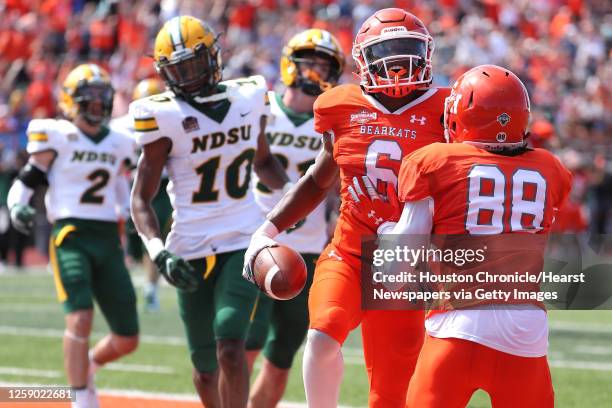 Sam Houston State running back Noah Smith and Sam Houston State wide receiver Chandler Harvin celebrate after scoring on a 23-yard touchdown...