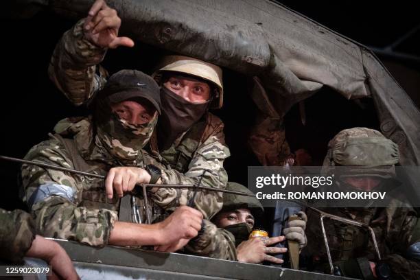Members of Wagner group looks from a military vehicle in Rostov-on-Don late on June 24, 2023. Rebel mercenary leader Yevgeny Prigozhin who sent his...