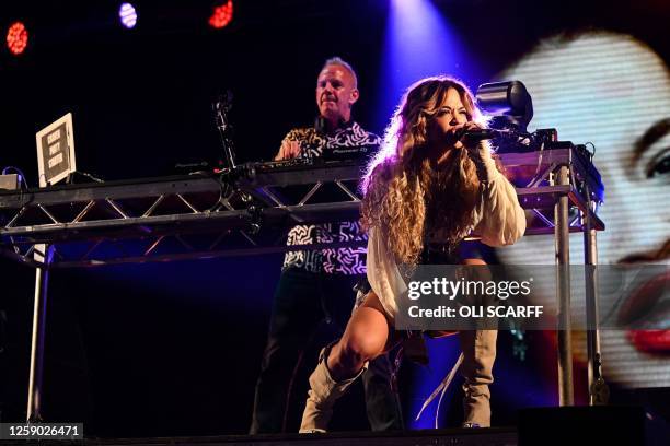 British DJ Quentin Leo Cook aka Fatboy Slim and British singer Rita Ora perform on The Park Stage on day 4 of the Glastonbury festival in the village...