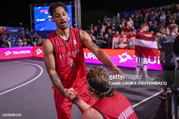 Belgian Dennis Donkor and Belgian Thibaut Vervoort react after a 3x3 basketball game between Belgium and Latvia, the final of the Basket 3x3...