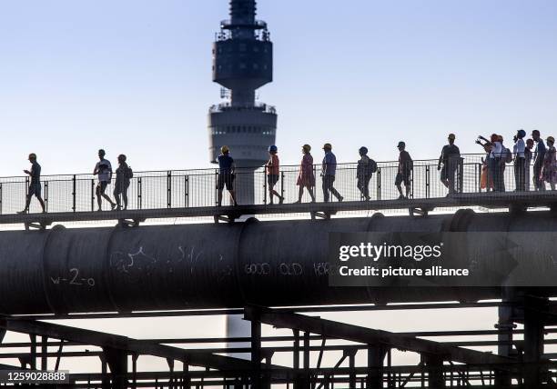 June 2023, North Rhine-Westphalia, Dortmund: Every 10 minutes there was a walk on the Skywalk dew blast furnace Phoenix West in Dortmund with unusual...