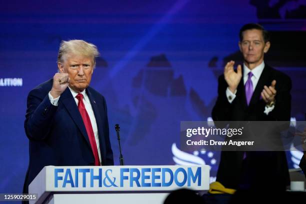 Republican presidential candidate former U.S. President Donald Trump concludes his remarks as Chairman of the Faith and Freedom Coalition Ralph Reed...