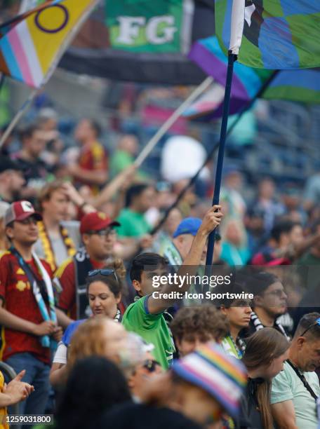 Seattle Sounders fan waves a flag during an MSL match between the Seattle Sounders and the Orlando City SC on June 24, 2023 at Lumen Field in...