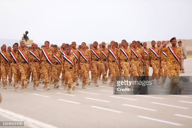 In this picture taken on June 24 soldiers take part in a military parade during a graduation ceremony for new cadets of the armed forces of the...
