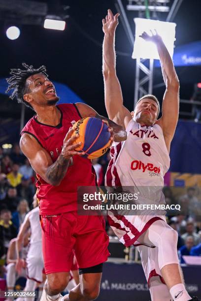 Belgian Dennis Donkor and Latvia's Kristaps Gluditis pictured in action during a 3x3 basketball game between Belgium and Latvia, the final of the...