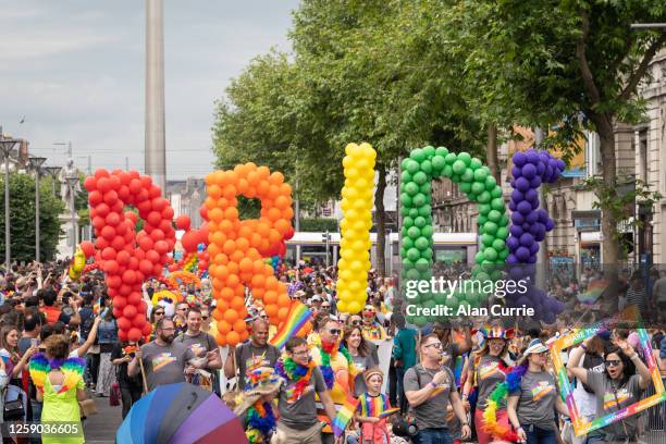 pride word made of balloons at start of dublin pride festival 2019 - festival float stock pictures, royalty-free photos & images