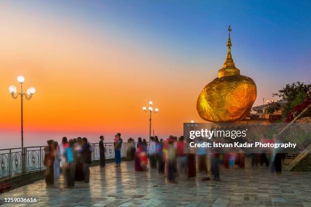 sunset gathering at the kyaiktiyo pagoda, myanmar - kyaiktiyo pagoda stock pictures, royalty-free photos & images