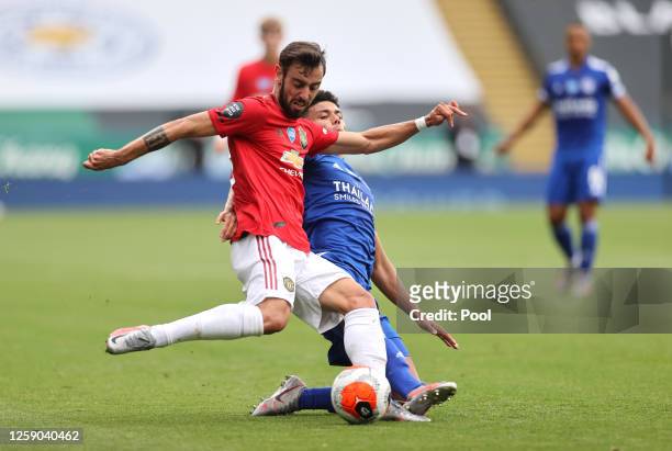 Bruno Fernandes of Manchester United is tackled by James Justin of Leicester City during the Premier League match between Leicester City and...