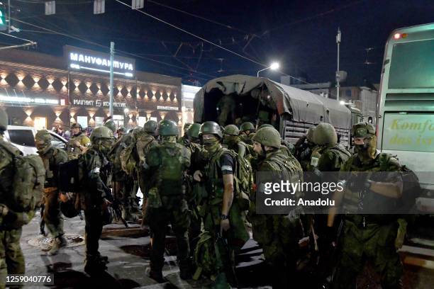 Members of the Wagner Group prepare to depart from the Southern Military District's headquarters and return to their base in Rostov-on-Don, Russia on...