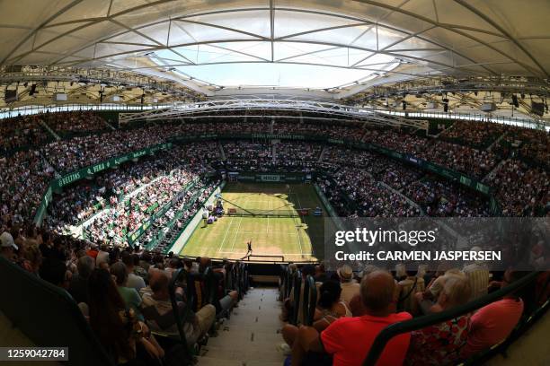 Spectators watch as Russia's Andrey Rublev plays against Kazakhstan's Alexander Bublik during the men's singles final tennis match of the ATP 500...