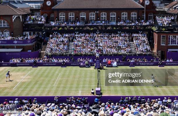 Spain's Carlos Alcaraz returns to Australia's Alex de Minaur during their men's singles final match at the Cinch ATP tennis Championships at Queen's...