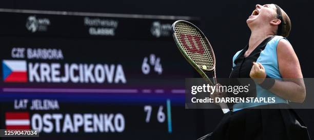 Latvia's Je?ena Ostapenko celebrates winning against Czech Republic's Barbora Krejcikova at the end of their women's singles final tennis match at...