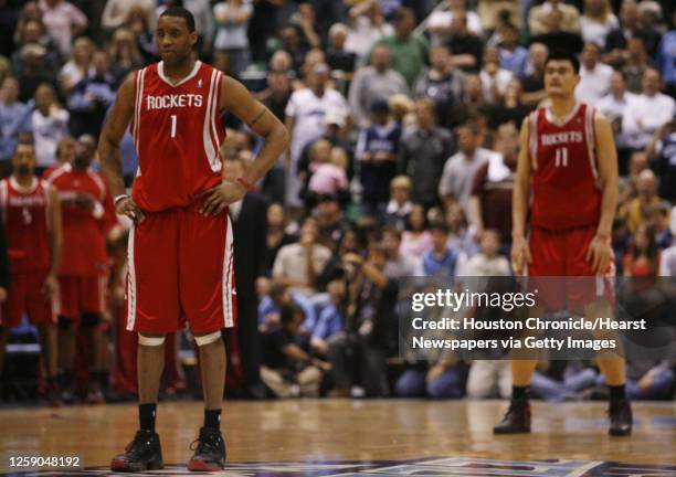 The Houston Rockets Tracy McGrady and Yao Ming stand on the court near the end of the fourth quarter of game six in the first round of the NBA...