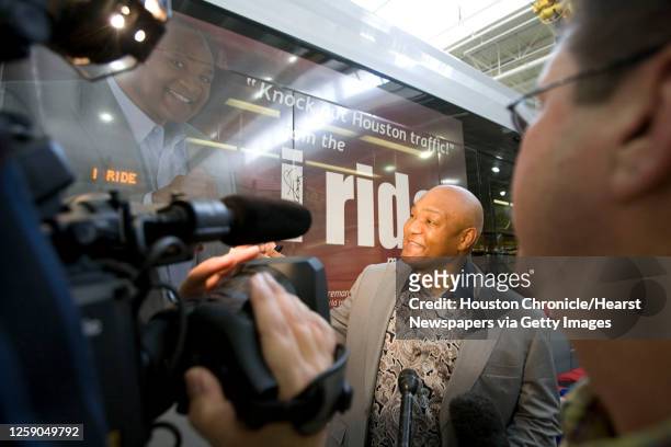 Two-time former heavyweight boxing champion George Foreman signs a Metro light rail train with his likeness for the new Metro promotion " i ride " at...