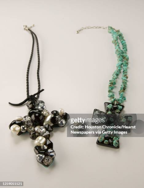 Glam Addiction hamdmade cross necklace pearls and stone on a leather rope chain, $150.00, from It's All About You and a Black and turquoise cross...