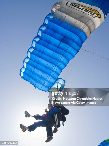 Army Sgt. John Botts completes a tandem skydive with tadem instrutor Ben Morson during the "Wounded Warriors skydive with Airborne Amputees" at...