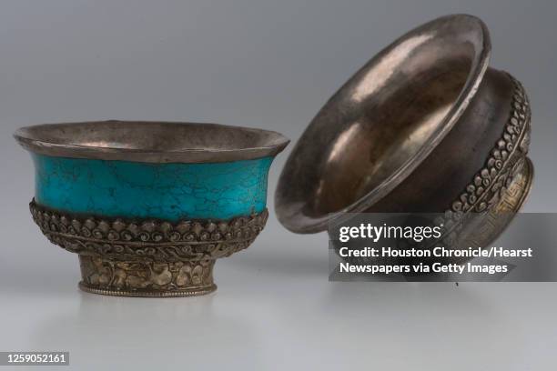 Turquoise and silver Tibetan prayer bowl, $400, and Wood and silver Tibetan prayer bowl, $400, from Tessera photographed in the Houston Chronicle...