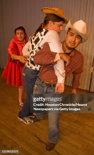 Ignacio Covarrubis as "Lumber Jack", Diego Olalla as "Woody", Eddie Gonzalez as "Little Red Riding Hood", during theatre Teatro Indigo's production...