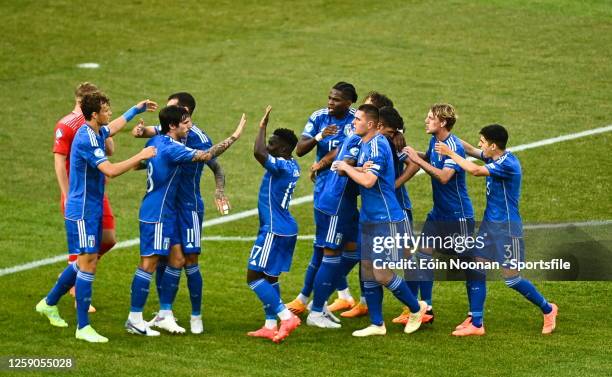 Lorenzo Pirola of Italy celebrates with teammates after scoring their side's first goal during the UEFA Under-21 EURO 2023 Finals Group D match...