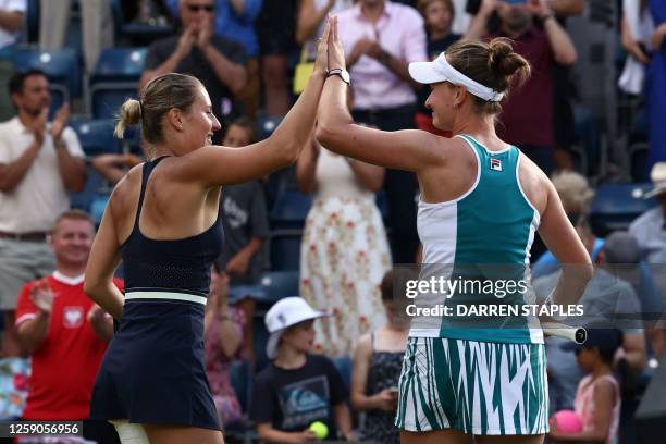 Czech Barbora Krejcikova and Ukraine's Marta Kostyuk celebrate their straight sets win over US player Alycia Parks and Australia's Storm Sanders in...