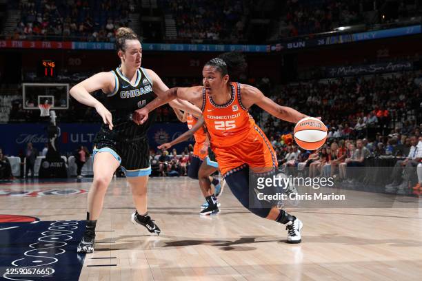 Alyssa Thomas of the Connecticut Sun dribbles the ball during the game against the Chicago Sky on June 25, 2023 at the Mohegan Sun Arena in...