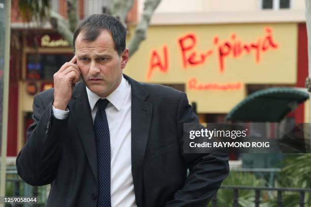 Front National vice president and Marine Le Pen's companion Louis Aliot gives a phone call on March 27, 2011 in Perpignan, southern France, during...