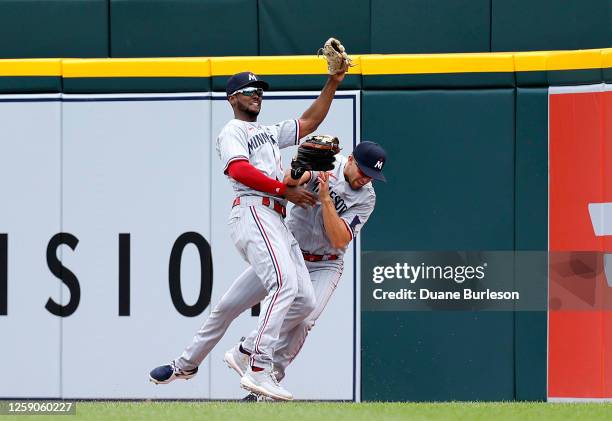 Alex Kirilloff of the Minnesota Twins collides with teammate Michael A. Taylor while catching a fly ball during the eighth inning against the Detroit...