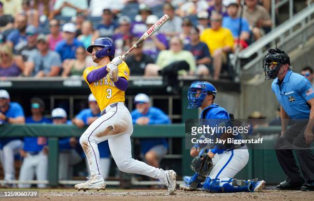 Dylan Crews of the LSU Tigers hits a single against the Florida Gators during the second inning of Game 2 of the NCAA College World Series baseball...
