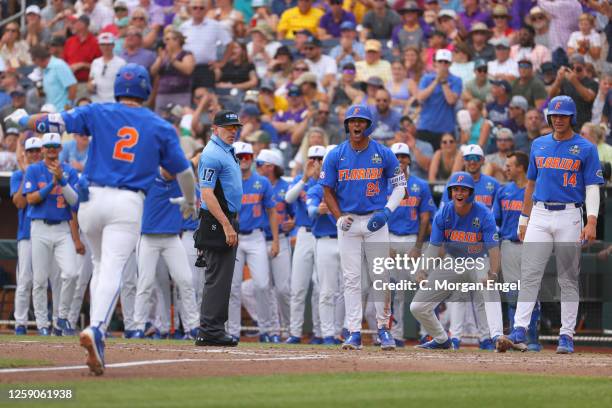 Josh Rivera, Luke Heyman and Jac Caglianone of the Florida Gators celebrate a grand slam against the LSU Tigers during game two of the Division I...