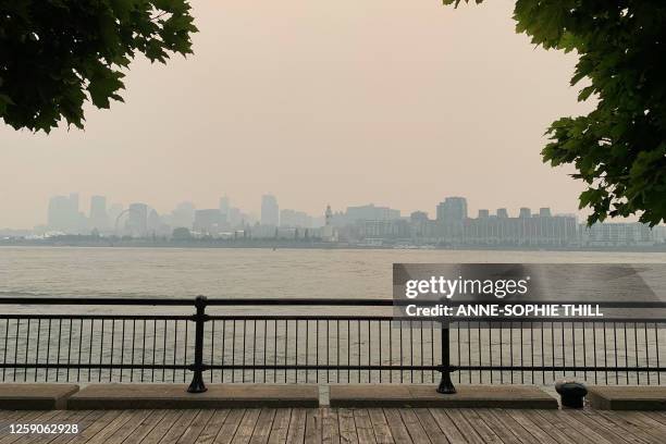 Montreal's skyline is pictured from Jean Drapeau Park with smoke caused by the wildfires, in Montreal, Quebec, on June 25, 2023. Montreal had the...