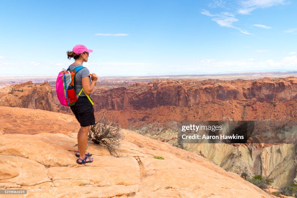 Woman Admiring the Canyons and Crater From the Upheaval Dome in Canyonlands National Park