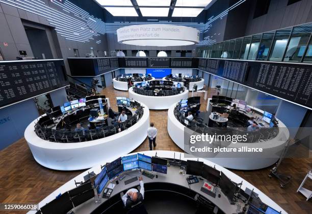 June 2023, Hesse, Frankfurt/Main: Stock traders work in the trading room of Deutsche Börse. Germany's leading index, the DAX, has been in existence...