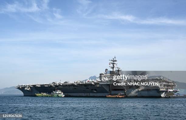 The USS Ronald Reagan, a US Navy Nimitz-class nuclear-powered aircraft carrier, is seen docked at the port during a visit in Danang on June 26, 2023....