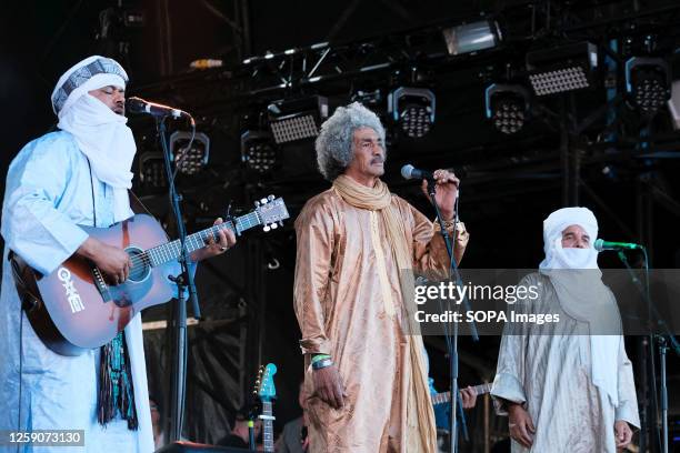 Abdallah Ag Alhousseyni, Ibrahim Ag Alhabib, Eyadou Ag Leche with Tinariwen a collective of Tuareg musicians from the Sahara Desert region of...