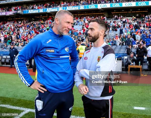 Dublin , Ireland - 25 June 2023; Laois manager Billy Sheehan, left, with Down manager Conor Laverty after the Tailteann Cup Semi Final match between...