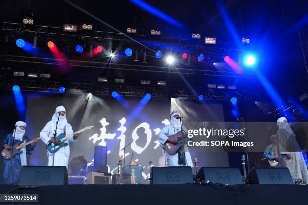 Abdallah Ag Alhousseyni, Ibrahim Ag Alhabib, Eyadou Ag Leche with Tinariwen a collective of Tuareg musicians from the Sahara Desert region of...