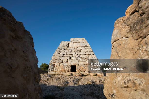 This photograph taken on June 22, 2023 shows the Naveta des Tudons, a prehistoric monument near Ciutadella on the island of Menorca. Human presence...